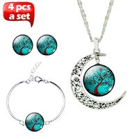 Juego de collar, aretes y pulsera luna con cristal verde